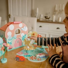child playing with a Fairy House Playset