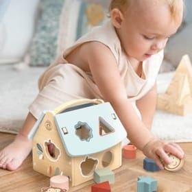 child playing with House Shape Sorter
