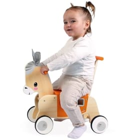 young child sitting on ride on donkey with shape sorter