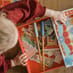 child opening the tray full of pieces for the Little Bluebird Theatre