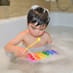 Child playing with Bath Time Xylophone
